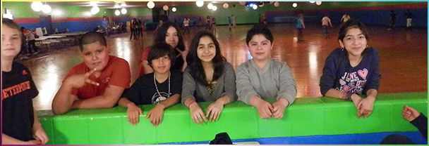 A group of friends together at the Skateville rink